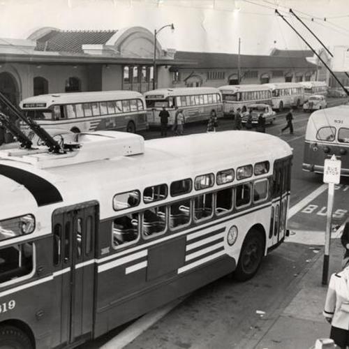 [Muni buses parked on Townsend Street, near Southern Pacific Depot]