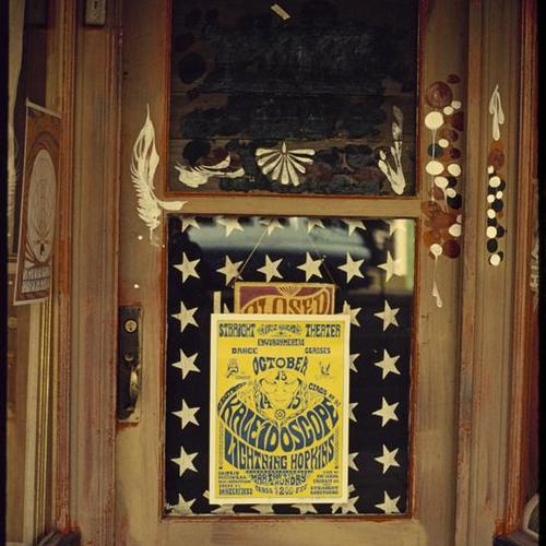 Doorway decorated with paint and posters