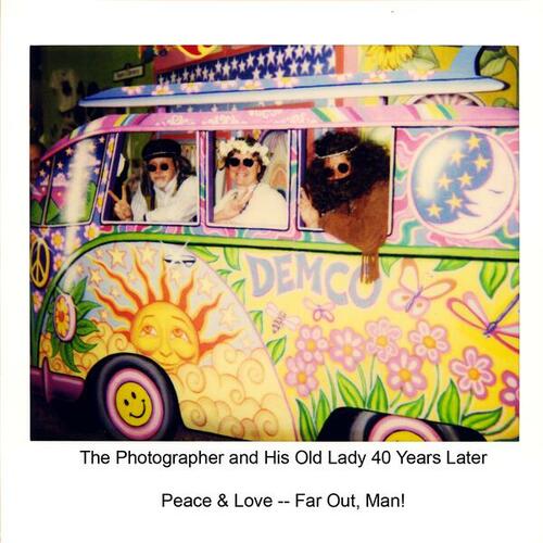 [Dennis Maness posing with others in a pretend hippie van]
