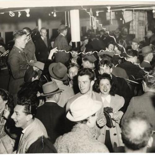 [People dancing on the lower deck of the ferryboat S.S. Eureka during its last trip]