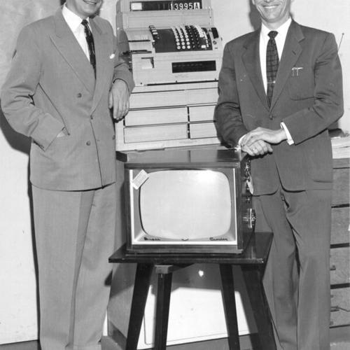 [Dick Sanford, manager of Hale's Appliance Stores, and Dick Walsh, manager of Hale's Oakland store posing with a Crosley Super V television set]