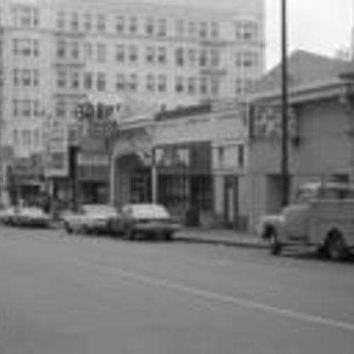 [Honour Garage and Cafe Exotica on Eddy Street, looking toward Jones intersection and Roosevelt Hotel]