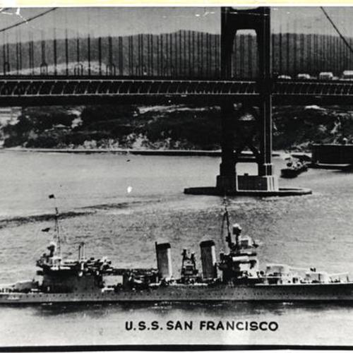 ["USS San Francisco" slips under the Golden Gate Bridge]