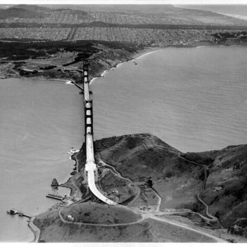 [Aerial view of the Golden Gate Bridge from over Marin County, looking south]
