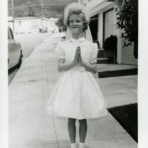 [Portrait of Carol's sister Nancy in communion dress]