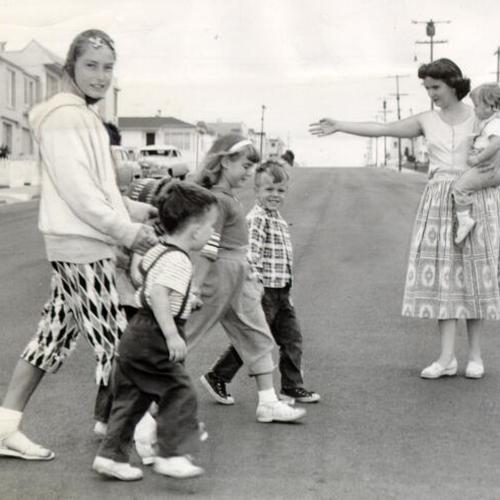 [Children crossing the street at the intersection of Ulloa Street and 44th Avenue]