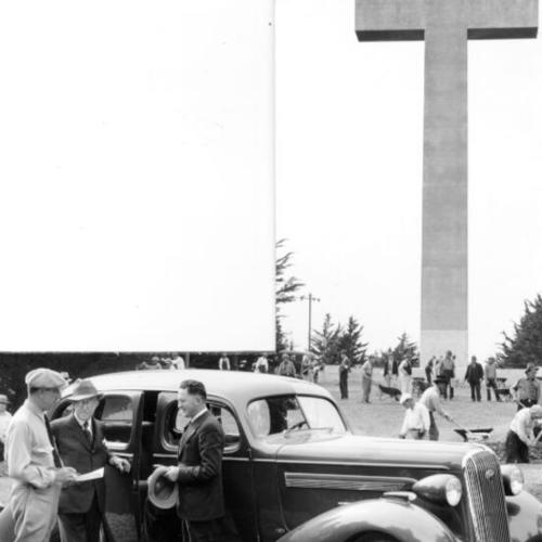 [Workers clean area around the cross on top of Mount Davidson]