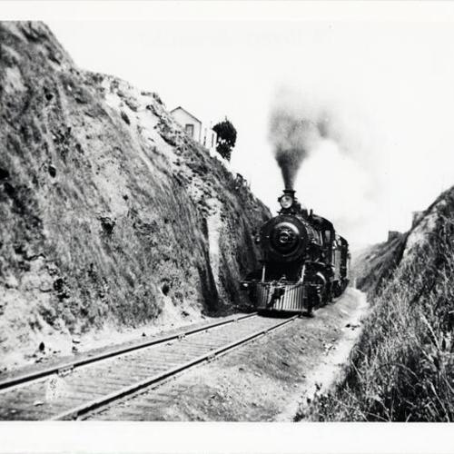 [Railroad train passing through the Bernal Cut]