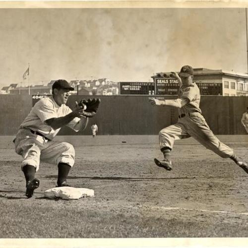 [Ted Jennings of the San Francisco Seals and Lockman of the New York Giants play at Seals Stadium]