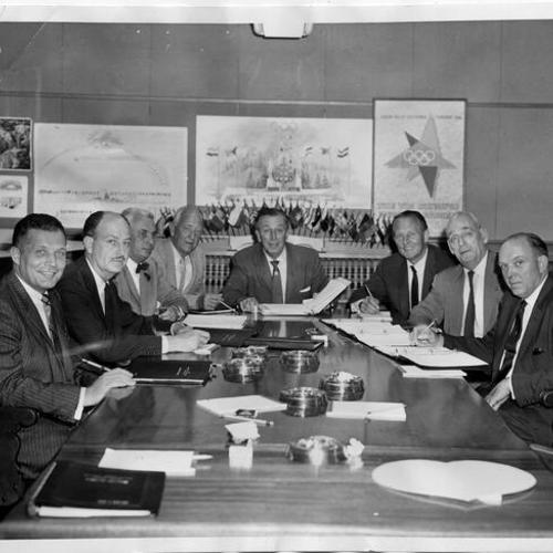 [Walt Disney, chairman of the Pageantry Committee for the VIII Olympic Winter Games meeting with his committee that will stage all of the ceremonies and entertainment]