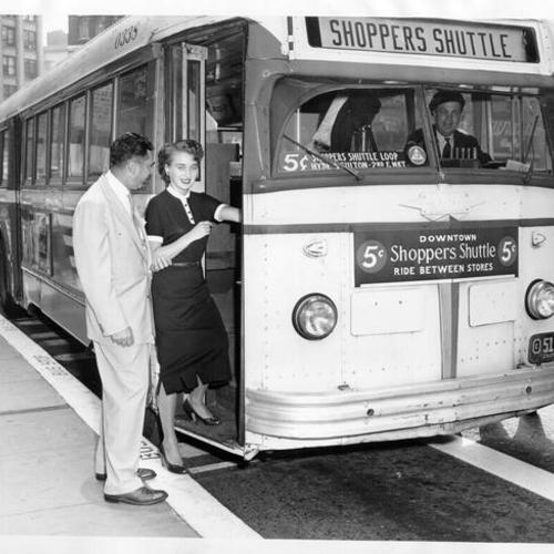 [Carol Woods and Marvin Lewis boarding 'Shopper Shuttle' bus]