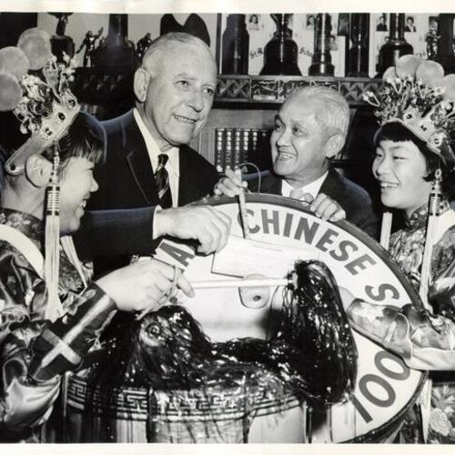 [Esther Torrie, Roy N. Buell, John Yehall and Janice Low during a fund raising drive on behalf of St. Mary's Chinese Girls Drum Corps]