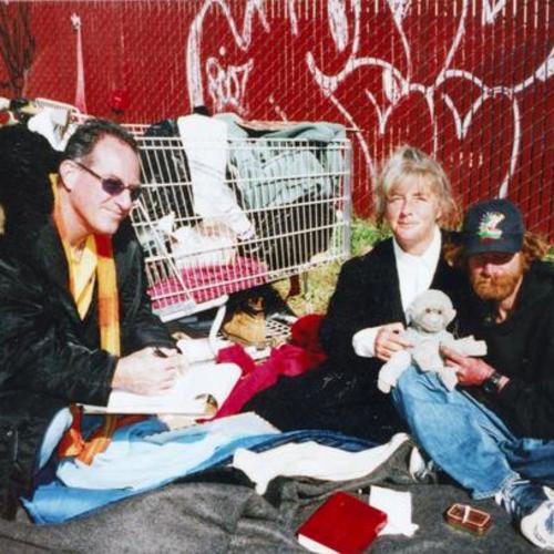 [Nurse practitioner helping three homeless people at Bryant and 8th Streets in 2003]