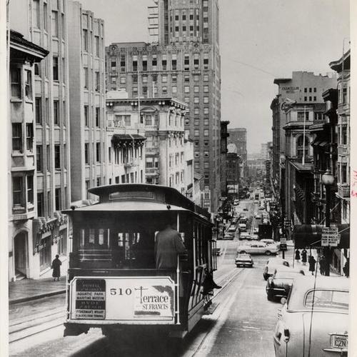 [Cable car heading down Powell Street toward Union Square]