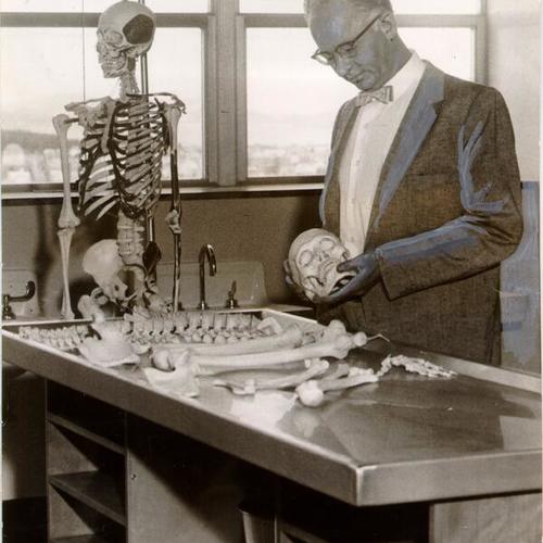 [Dr. William O. Reinhardt unpacking a skeleton in the University of California's Medical Sciences Building in San Francisco]