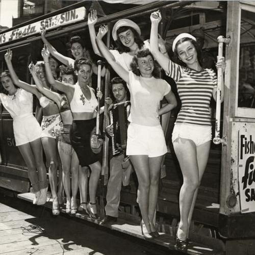 [Group of women riding a Powell Street cable car to advertise the "Fishermen's Fiesta" at Fisherman's Wharf]