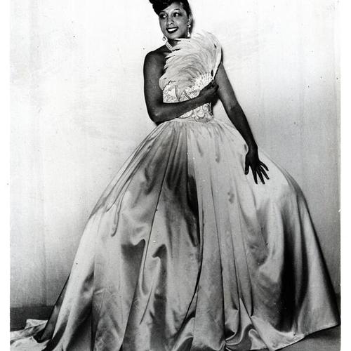 [Singer and dancer Josephine Baker models gown by Ardanse]