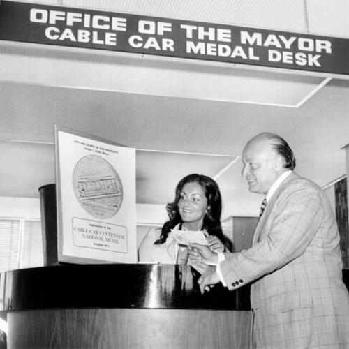 [Mayor Joseph Alioto at the Cable Car Medal Desk]