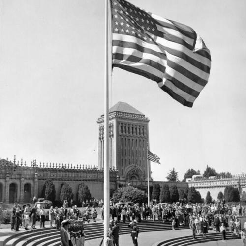 [Flag ceremony taking place in front of the De Young Museum in Golden Gate Park]