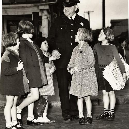 [Officer Gus Wuth with five unidentified girls]