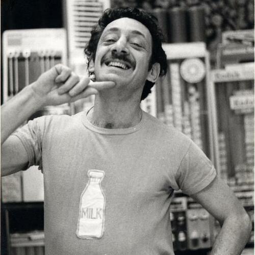 [Harvey Milk posing in milk bottle t-shirt in Castro Camera]