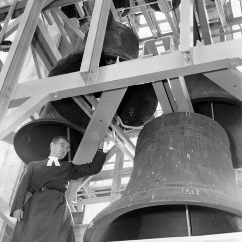 [David R. Forbes inspecting one of the 43 bells of Grace Cathedral's Coulsen Carillon]