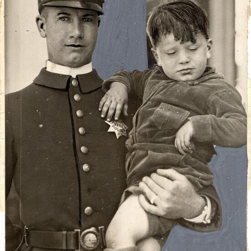 [Officer George Hussey carrying unidentified boy]