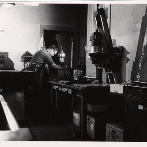 [Inspector Robert Moser working in the Photo lab in Old Hall of Justice]