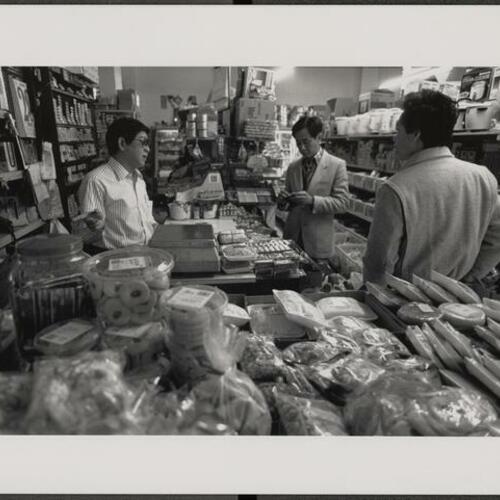 Dong Chao (Left) owner of Viet Hoa Company grocery store on Leavenworth Street
