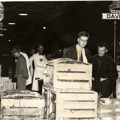 [Health Director Ellis D. Sox and A. B. Crowley, his chief inspector, during an inspection of produce markets]