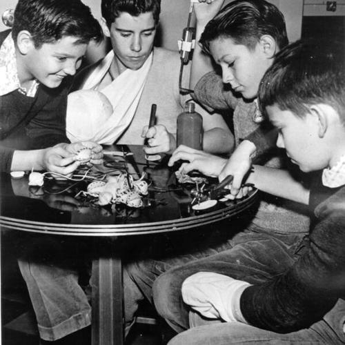 [Group of boys at Shriners' Hospital for Crippled Children making presents for football players in the East-West Shrine game]