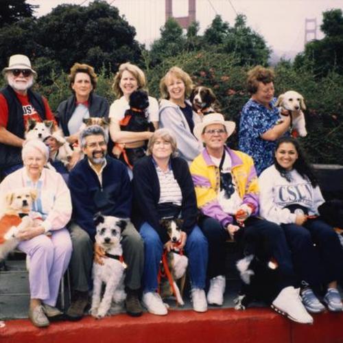 Portrait of people with their hearing ear dogs at Golden Gate Bridge