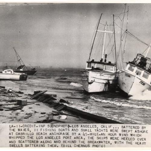 [Fishing boats and small yachts swept ashore at Cabrillo Beach Anchorage]