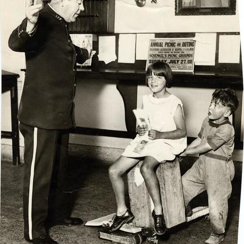 [Officer Jack McGreevy talking with a boy called Joe and an unknown girl]
