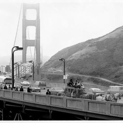 [Four-horse-drawn stagecoach crossing the Golden Gate Bridge to promote the opening of the Army Corps of Engineers' Bicentennial exhibit"