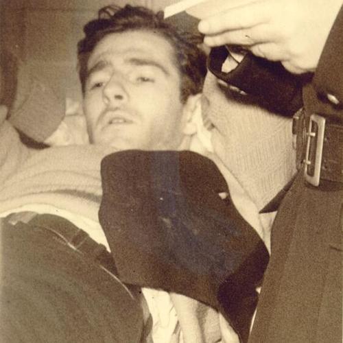 [Injured Longshoremen striker, Eugene Dunbar, laying in hospital bed]