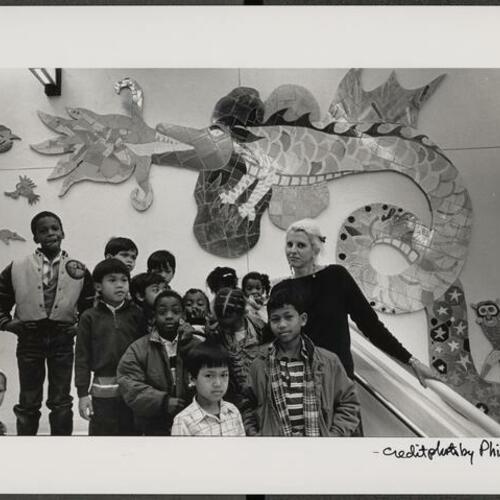 Joanna Poethig and child artists with their mural in Boeddeker Recreation Center