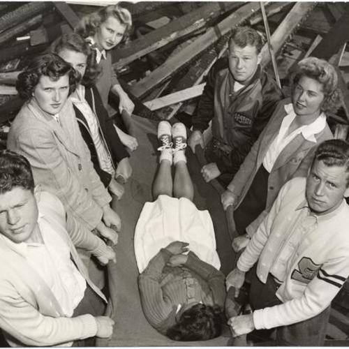 [Group of students practicing a first aid lesson at San Francisco State College]