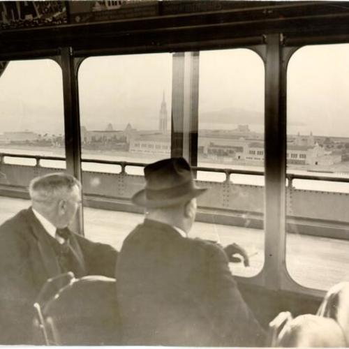 [Passengers on board the first electric train to cross the San Francisco-Oakland Bay Bridge]