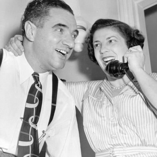 [George Christopher and wife, Tula Christopher, getting a phone call regarding the latest election returns]