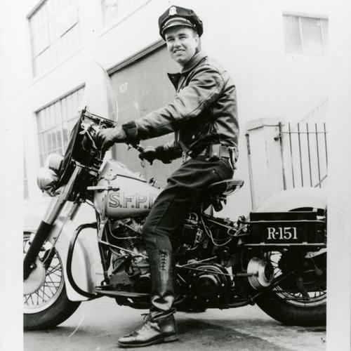 [Carol's father Ed, police officer, riding motorcyle]