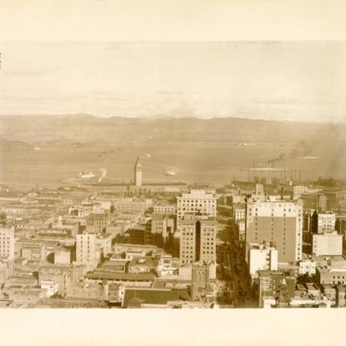 [View of San Francisco, looking east, showing the Ferry Building and ships on the bay]