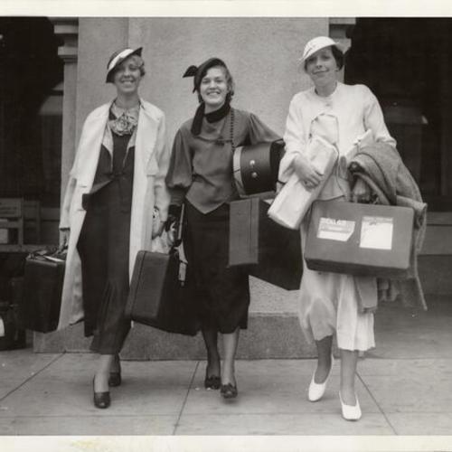 [Three travelers from Los Angeles carrying their own baggage due to the general strike in San Francisco]