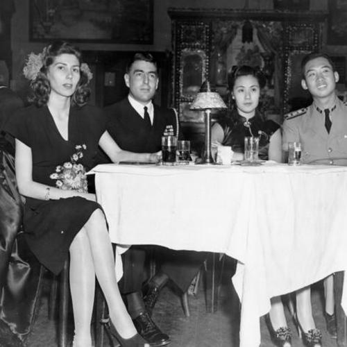 [Commander Heng Hsu (right), his wife Amy, Lt. Commander D. A. Lord and Mrs Lord, at the Shanghai Low nightclub]