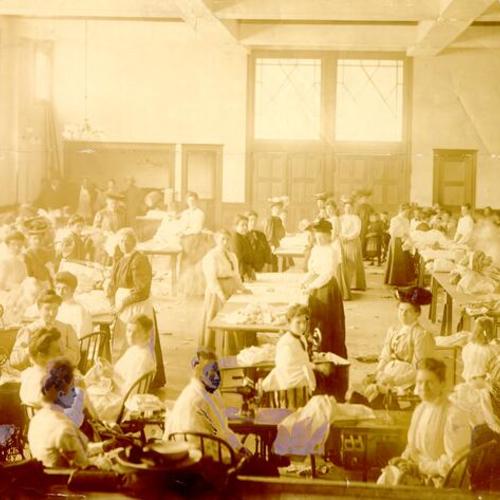 [Group of women relief workers sewing]