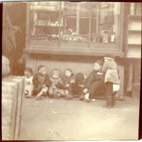 [Group of Chinese children sitting together]