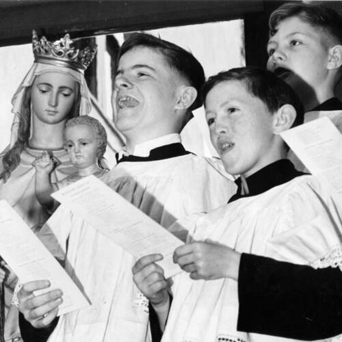 [St. James Church Boy's Choir members Kevin Creamer, William Hart and James Magner]