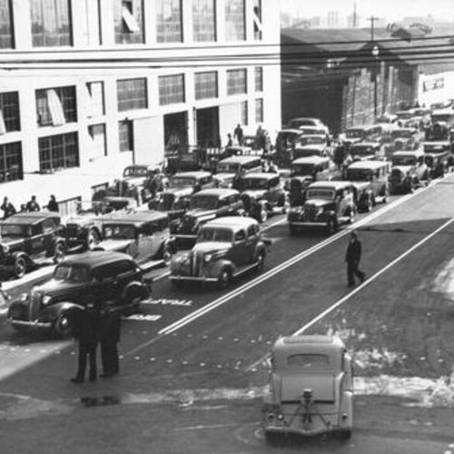 [Lines of automobiles awaiting at Fifth street for the official opening of the San Francisco-Oakland Bay Bridge to public]