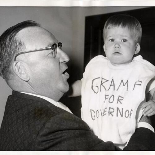 [Edmund G. Brown holding his granddaughter Kathy Kelly]