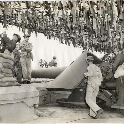 [Artillerymen preparing a large gun at Fort Winfield Scott, Presidio]